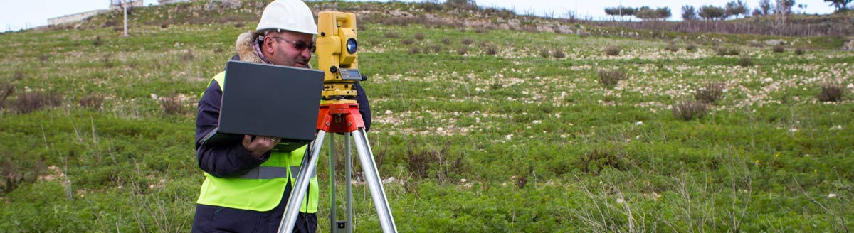 Surveyor with computer in field