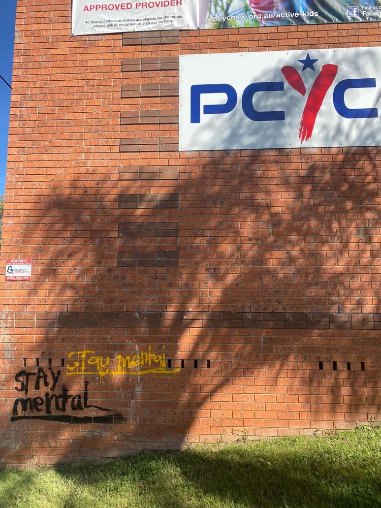 Before Cleaning The Graffiti Wall — High Pressure Cleaning Service In Tamworth, NSW