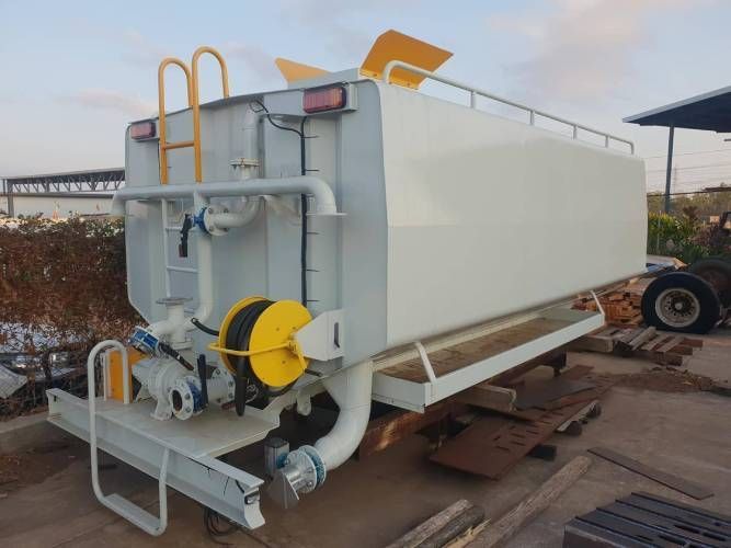 A White Trailer With a Yellow Hose Attached to It — Roll Press NT In Tivendale, NT