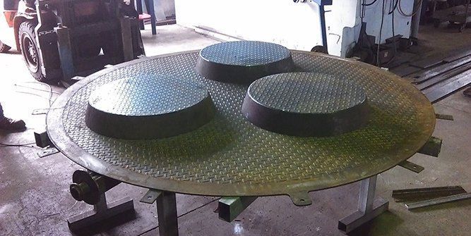 A Large Metal Plate With Three Circles on It is Sitting on a Table — Roll Press NT In Tivendale, NT