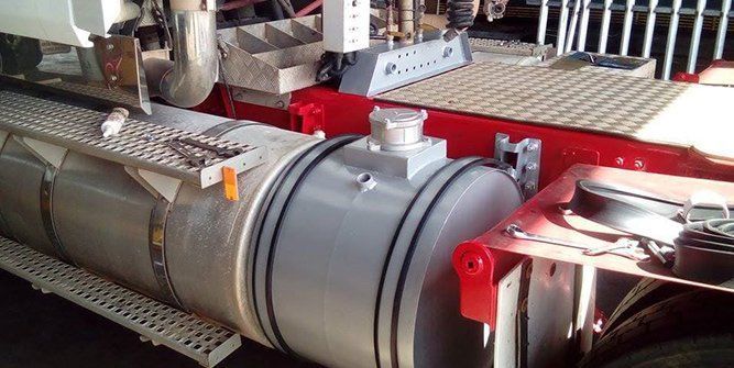 A Large Tank is Sitting on the Side of a Truck — Roll Press NT In Tivendale, NT