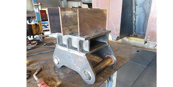 A Piece of Metal is Sitting on Top of a Table — Roll Press NT In Tivendale, NT