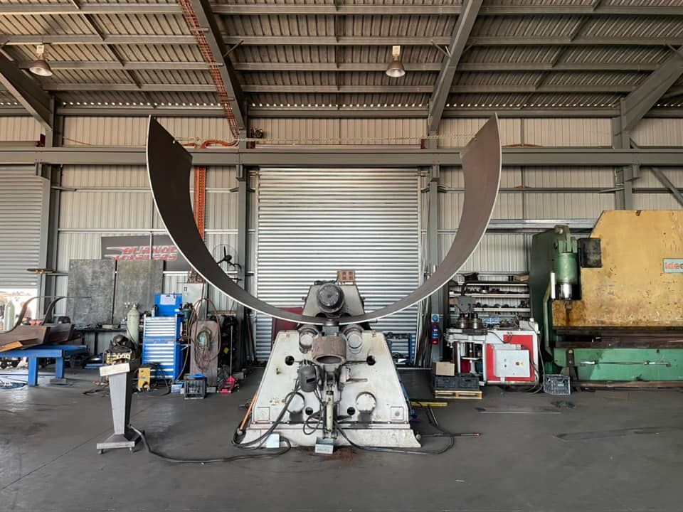 A Large Machine is Sitting in the Middle of a Factory — Roll Press NT In Tivendale, NT