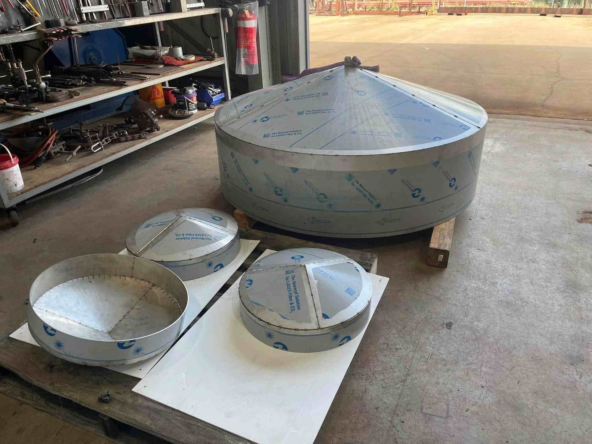 A Large Stainless Steel Object is Sitting on Top of a Table — Roll Press NT In Tivendale, NT