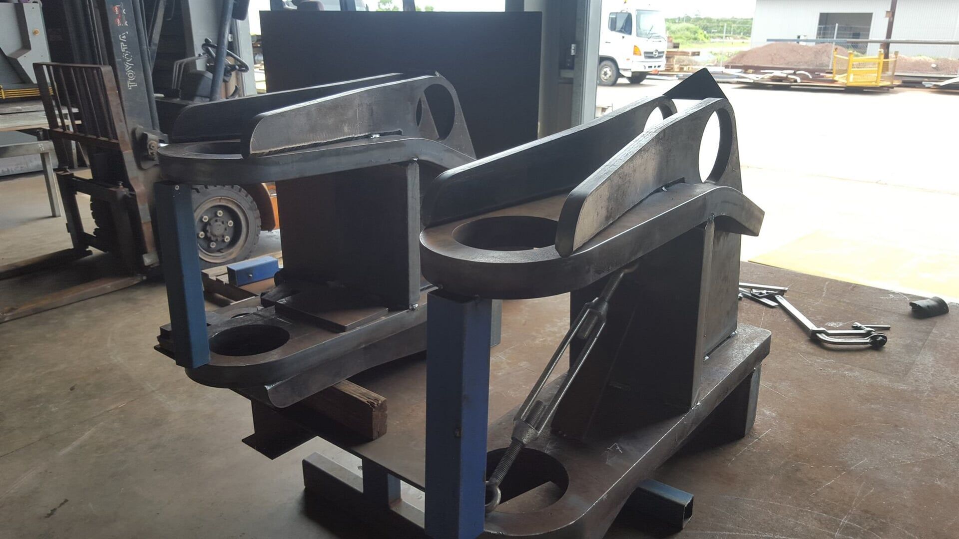 A Piece of Metal is Sitting on a Table in a Garage — Roll Press NT In Tivendale, NT