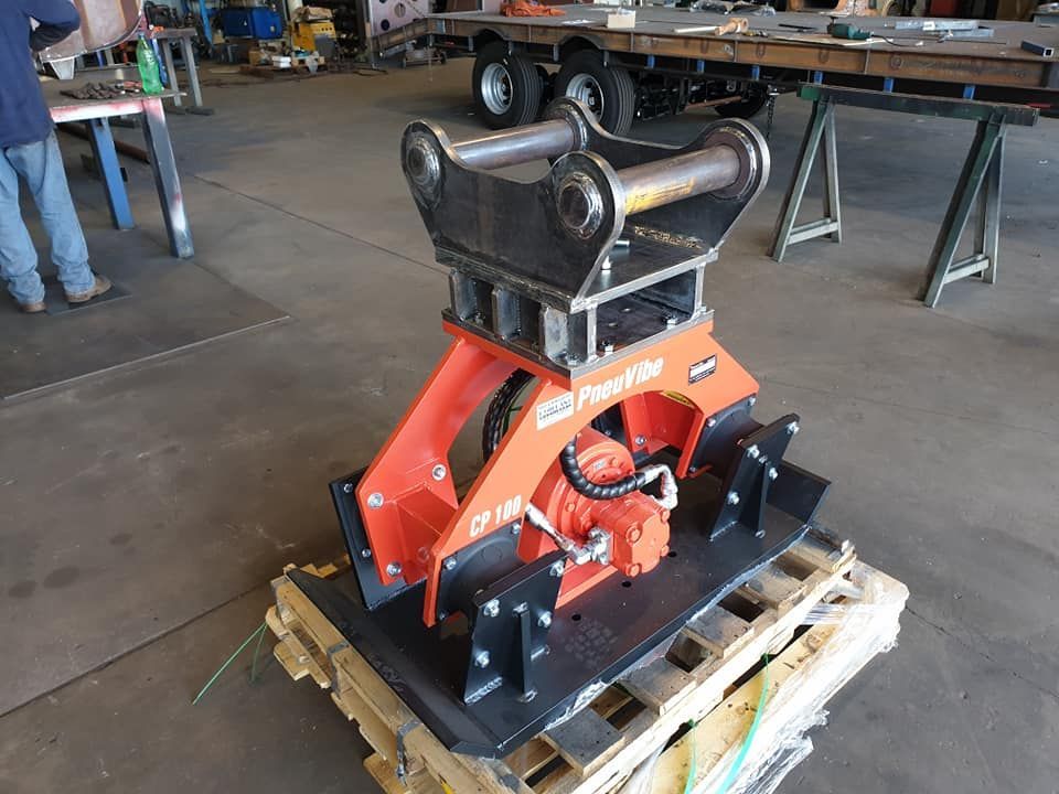 A Machine is Sitting on Top of a Wooden Pallet in a Factory — Roll Press NT In Tivendale, NT