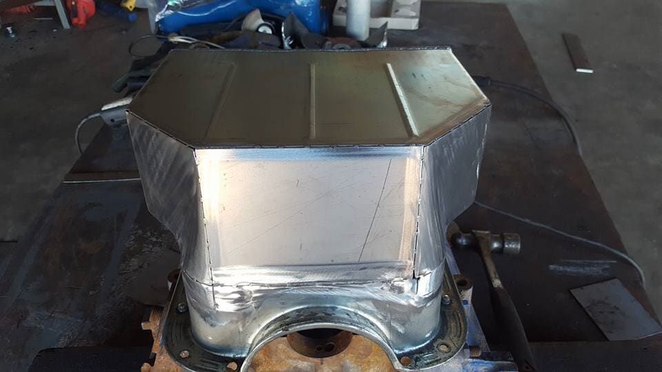 A Metal Box is Sitting on Top of a Metal Table — Roll Press NT In Tivendale, NT