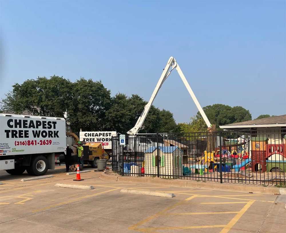 A cheapest tree work truck is parked in a parking lot