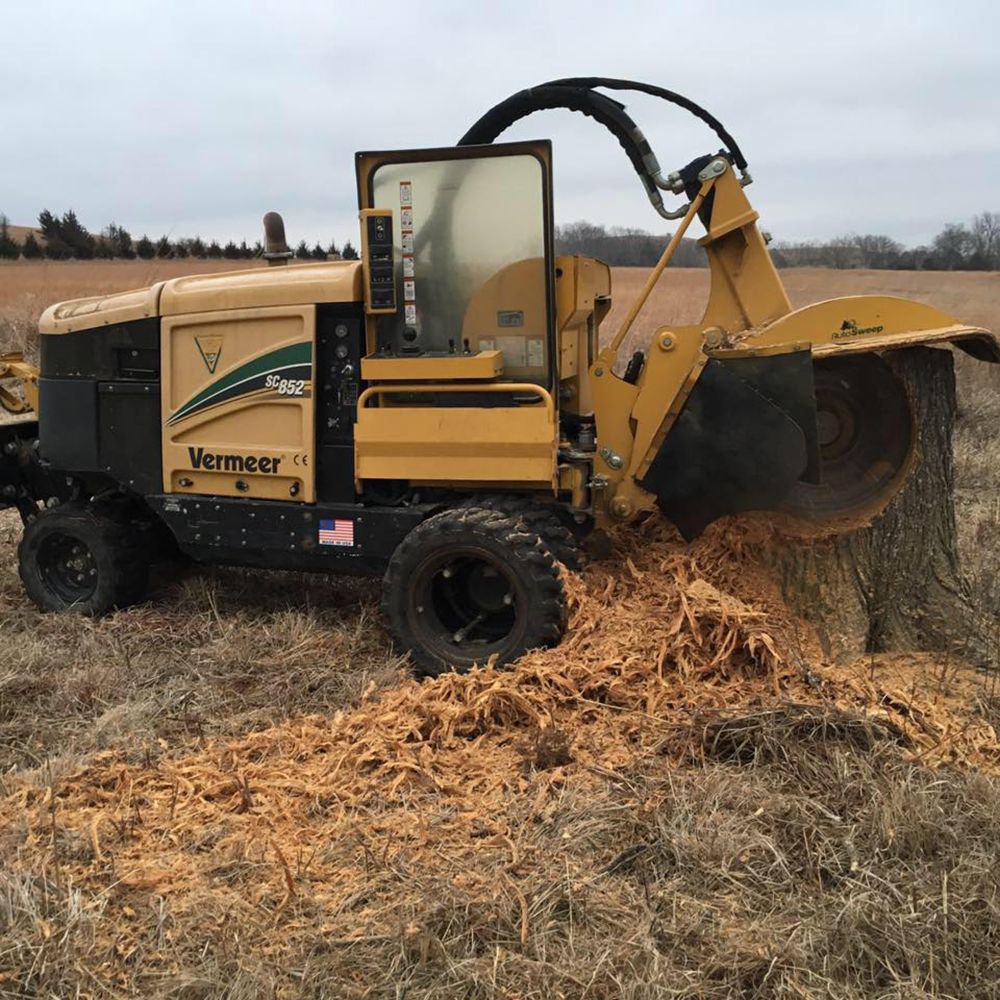 A verner stump grinder is working on a tree stump