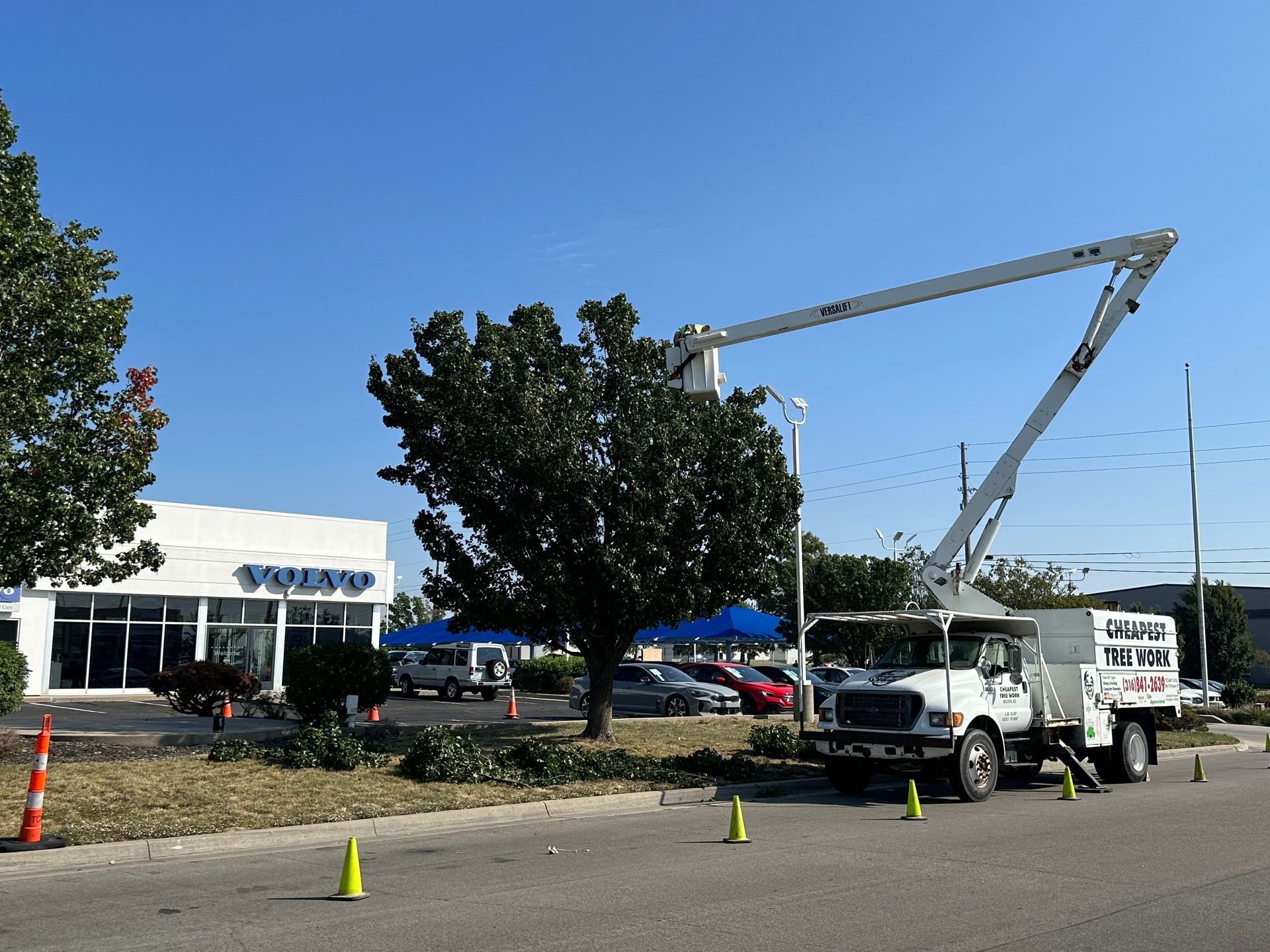 A volvo truck is parked in front of a building