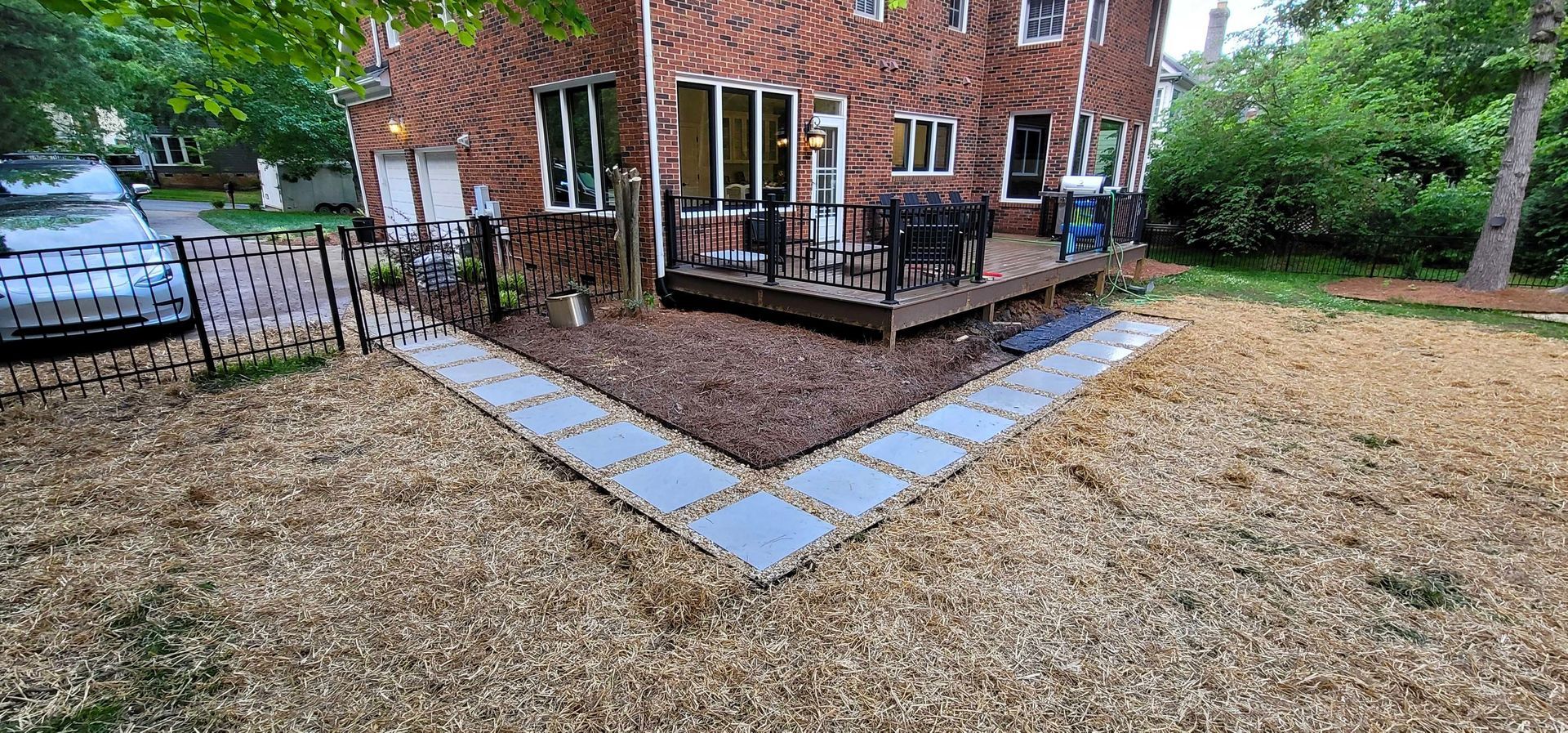 A custom walkway installation in Charlotte, NC - Haven Landscape Design hard at work