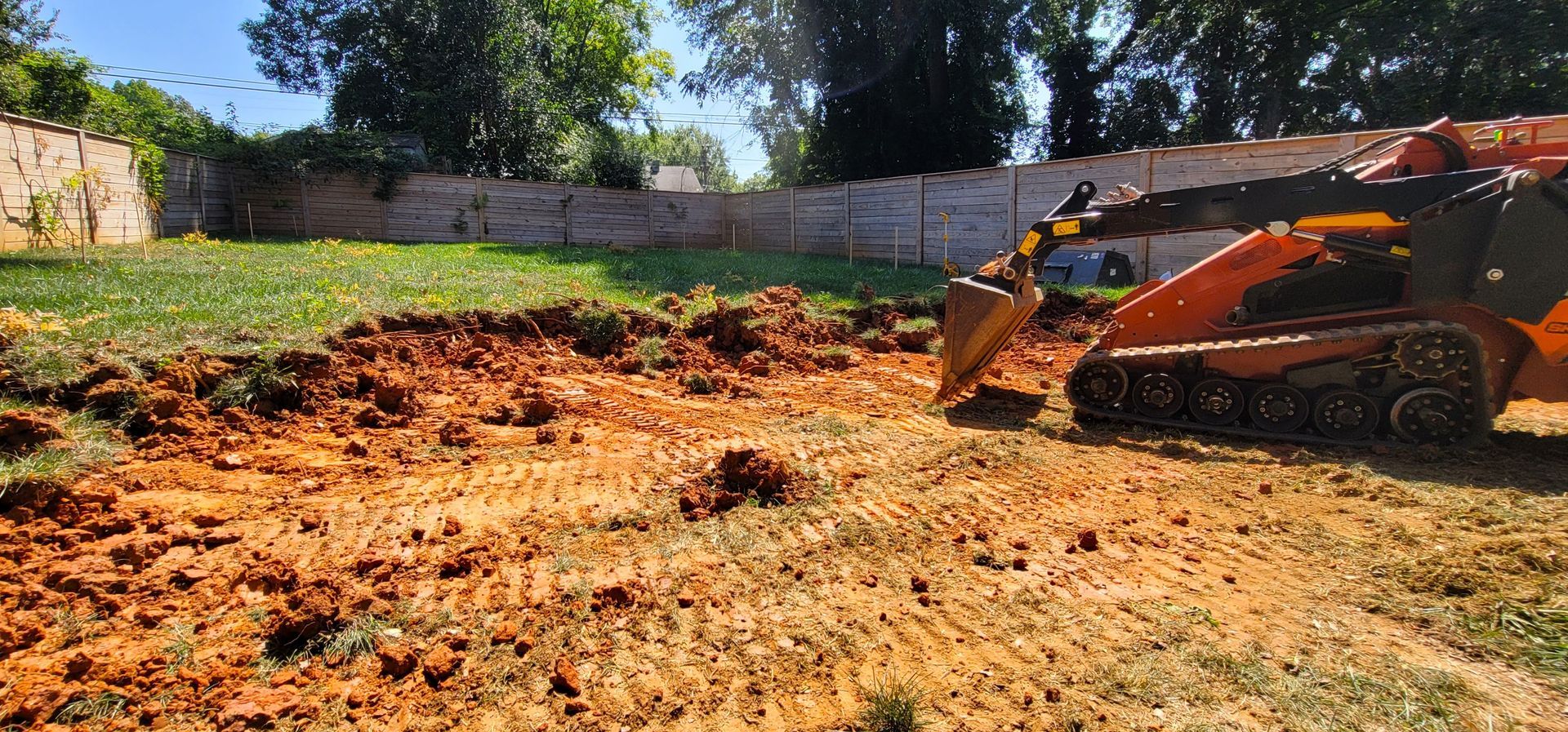 A home in Charlotte, NC getting an origami landscape installation - Haven Landscape Design hard at work.