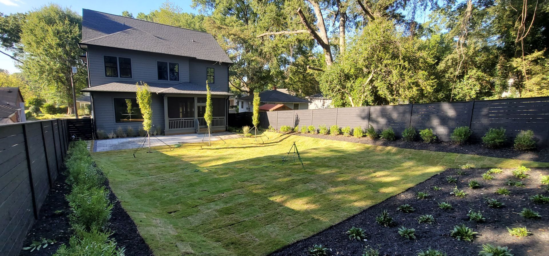 A large house with a large lawn in front of it.