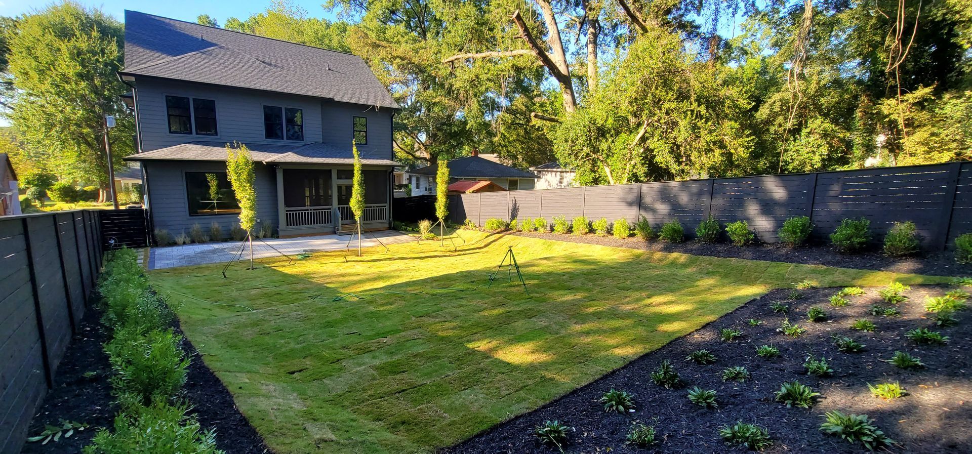 A large house with a large lawn in front of it.