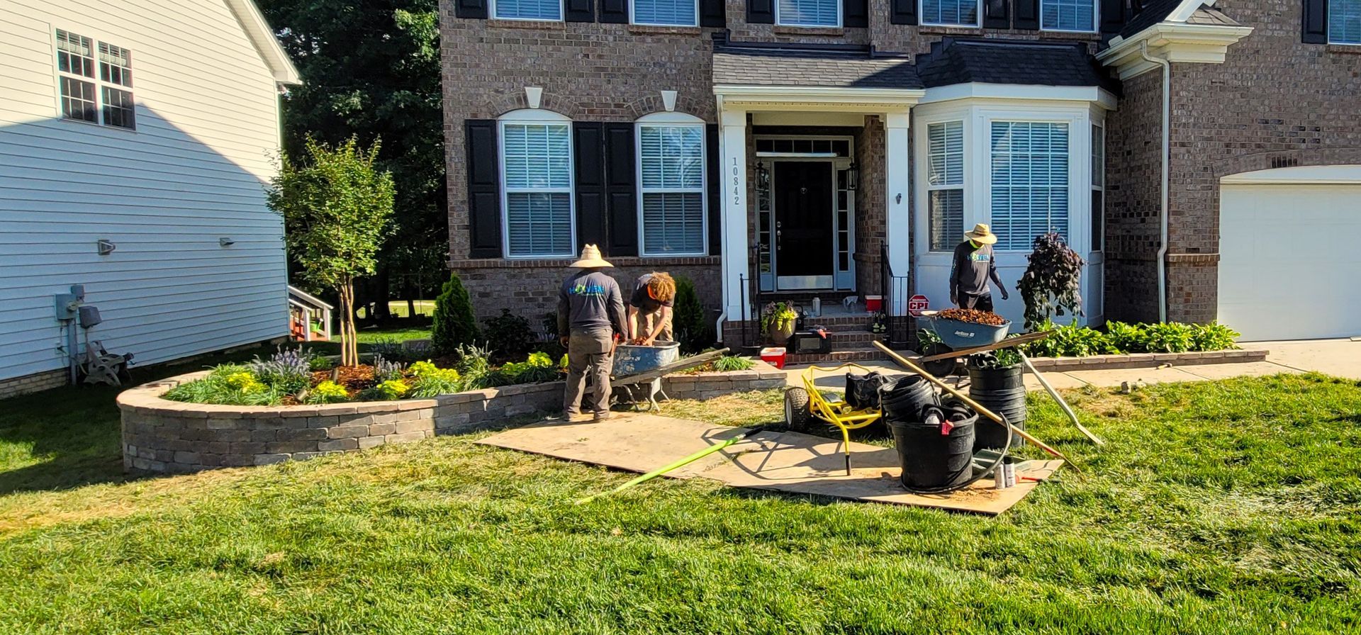 A home in Charlotte, NC getting sod installation - Haven Landscape Design hard at work.