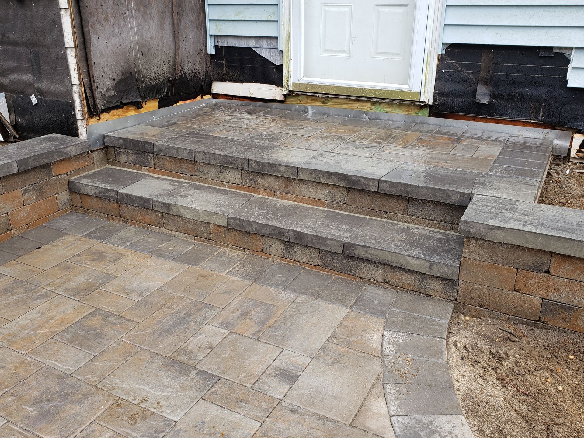 A set of steps leading up to a doorway of a house.