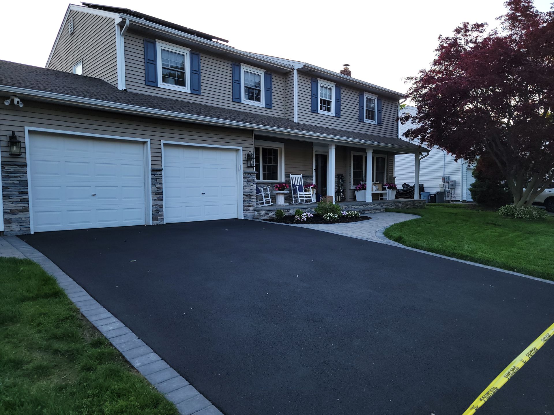 A house with two garage doors and a driveway