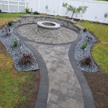 There is a fire pit in the middle of the patio.