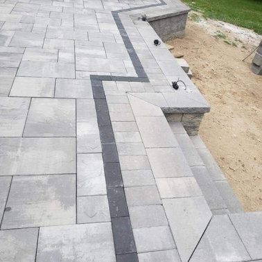 A patio with a black line on the side of it.