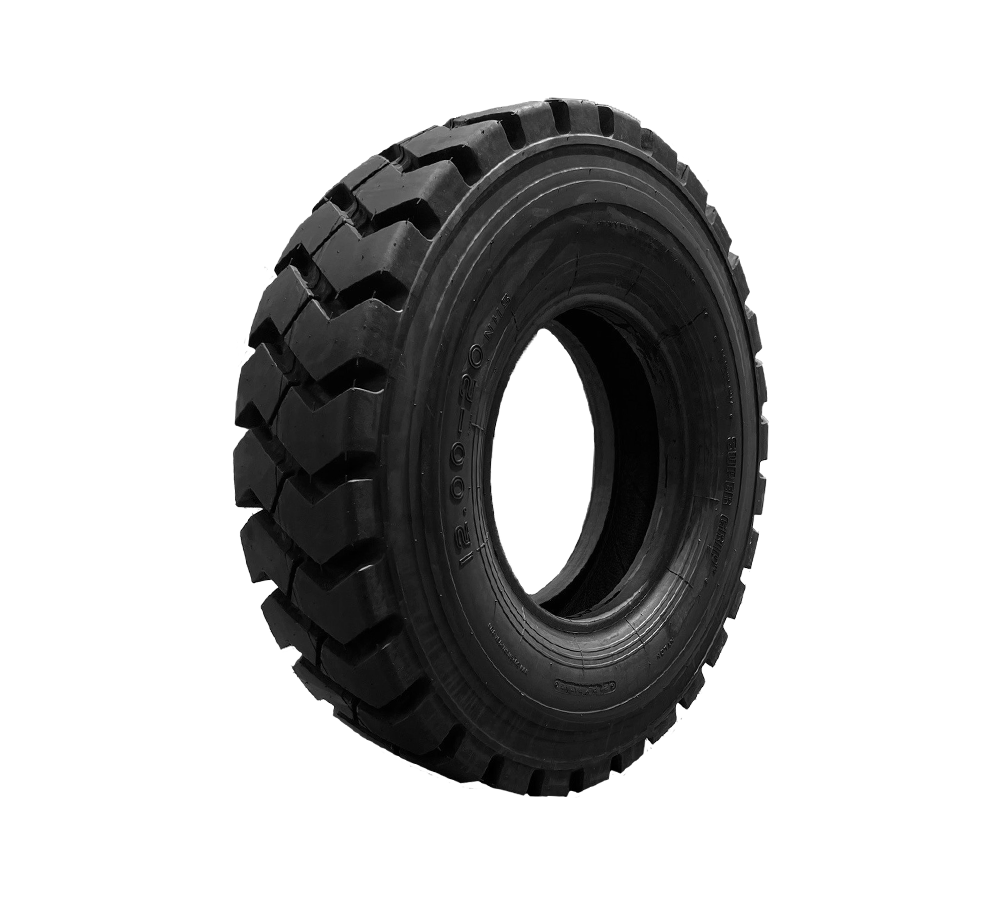 A close up of a mining tire on a white background