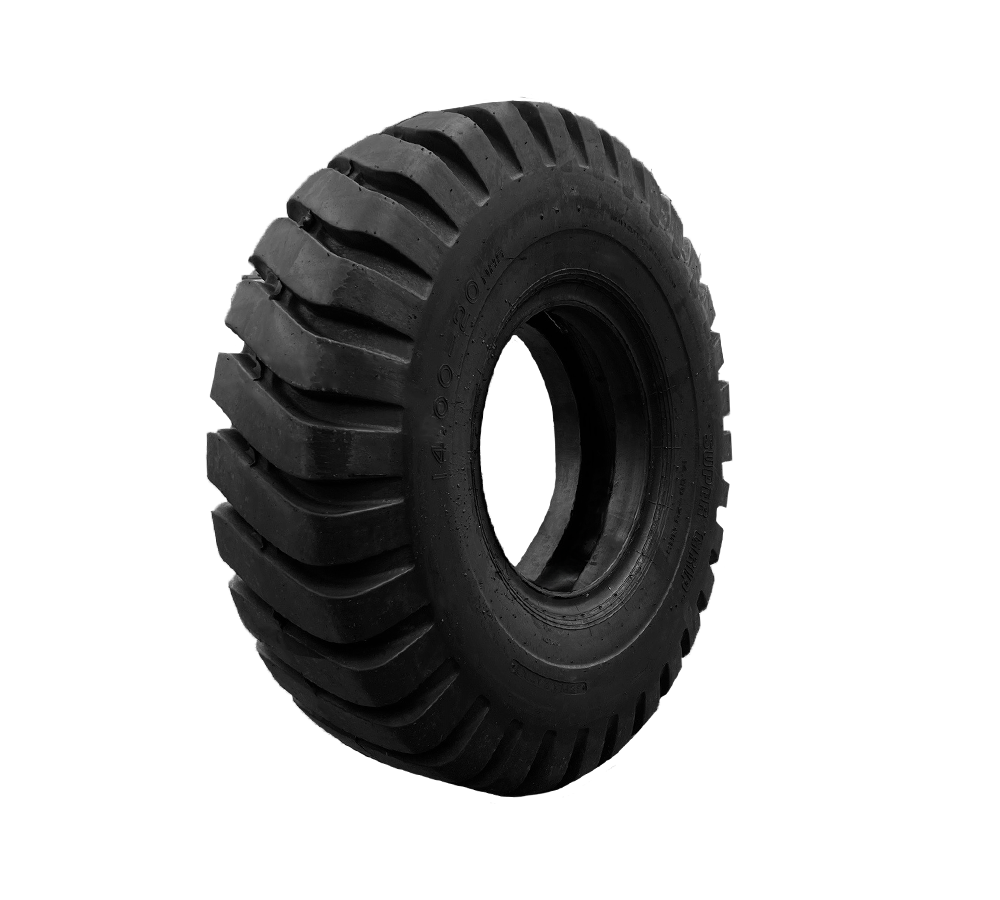 A close up of a black mining tire on a white background