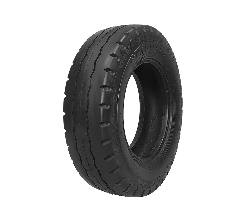 A close up of a black rib tire on a white background