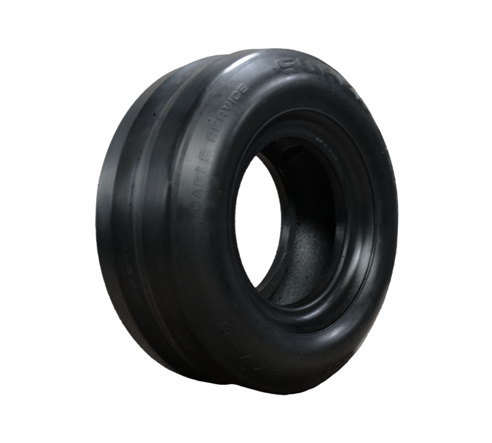 A close up of a black tire on a white background