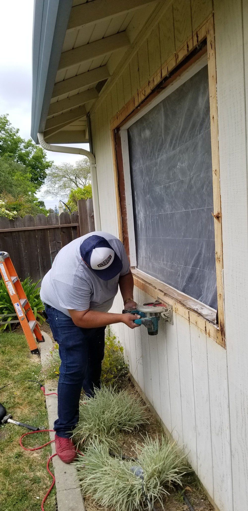 Man Cutting Window Frame — El Sobrante, CA — Wadsworth Glass Inc.