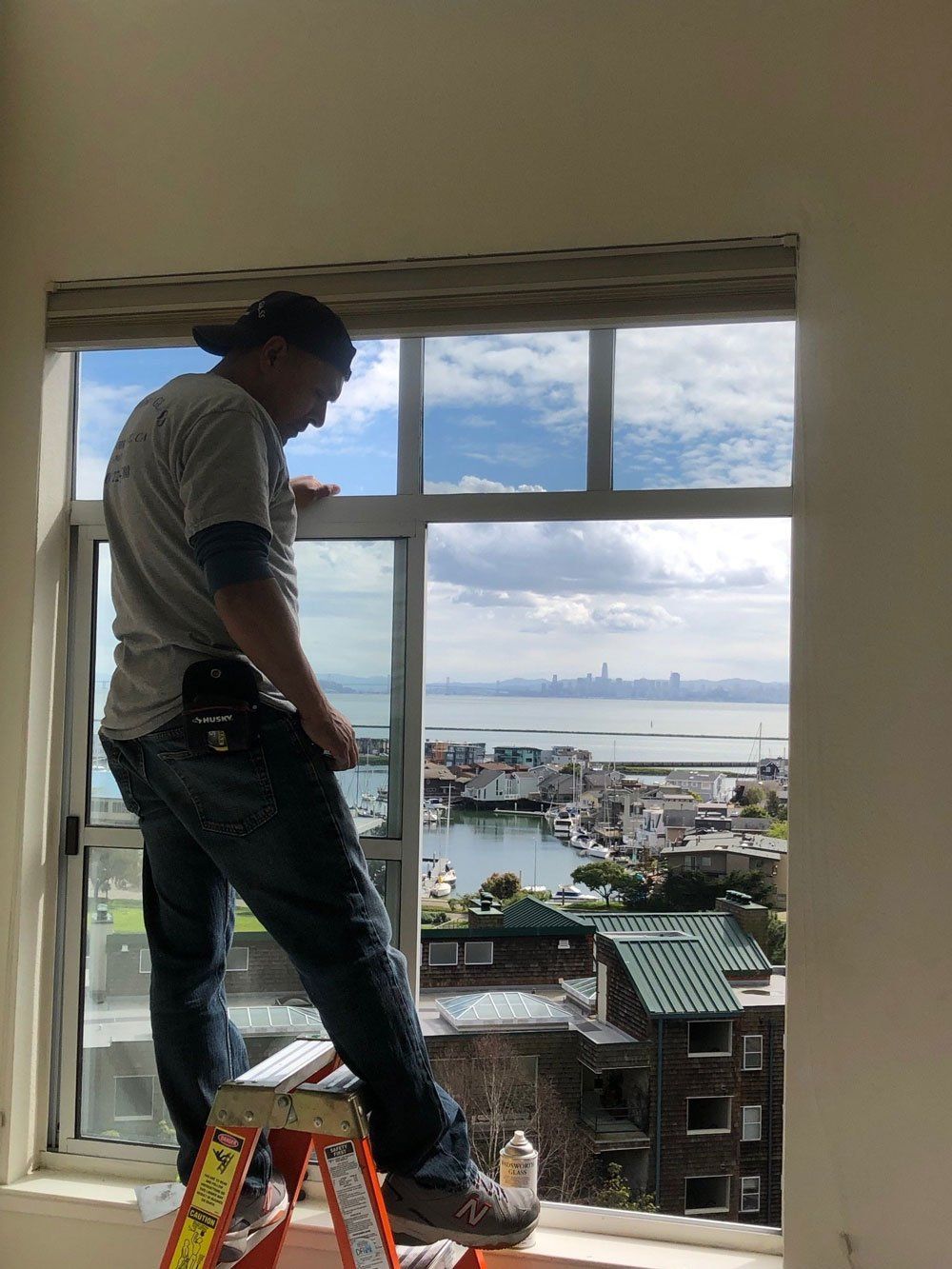Man Installing New Window — El Sobrante, CA — Wadsworth Glass Inc.