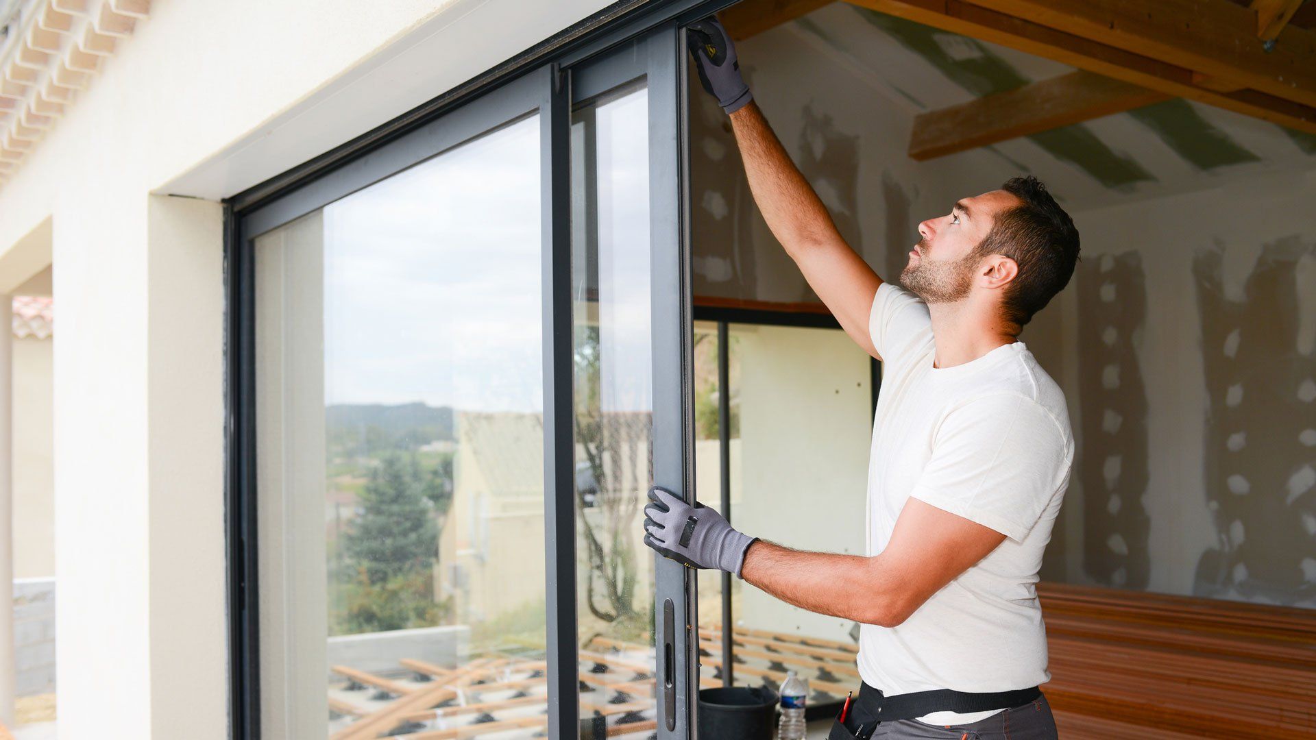 Man Checking Sliding Glass Door — El Sobrante, CA — Wadsworth Glass Inc.