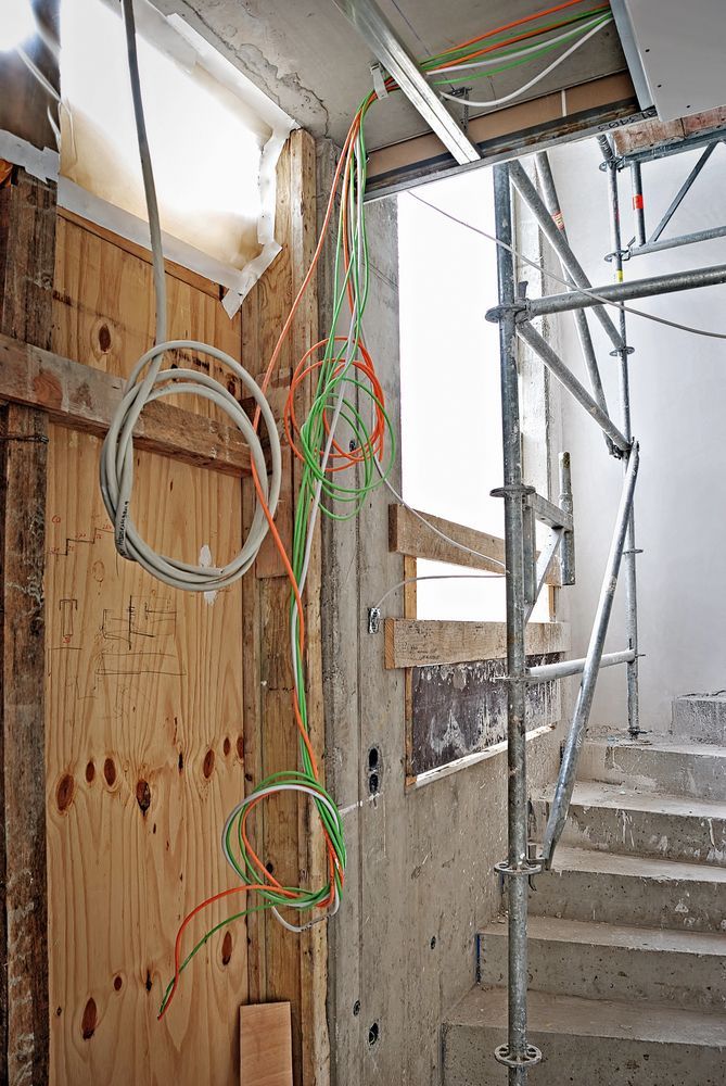 Construction Site: Exposed Wires, Plywood, Concrete Stairs, Scaffolding — CDT Electrical in Tweed Heads, NSW
