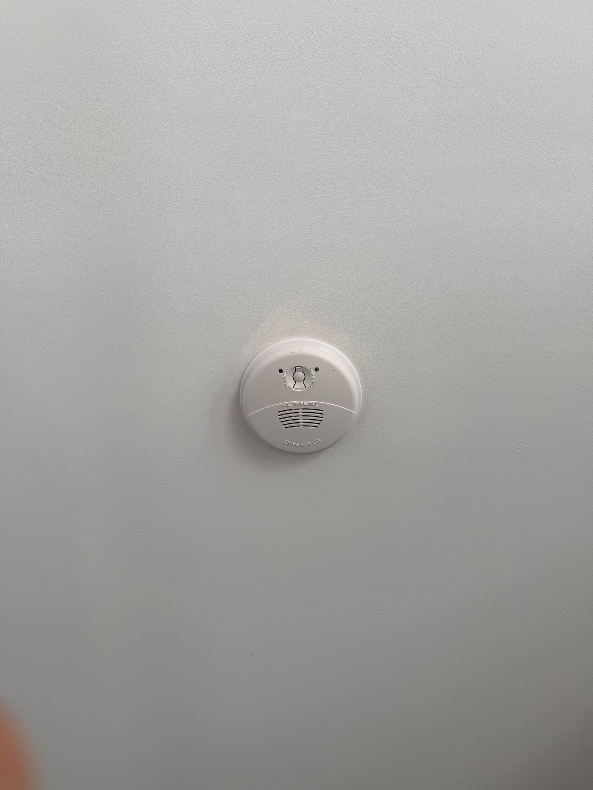 White Smoke Detector Mounted on a White Ceiling — CDT Electrical in Lennox Head, NSW