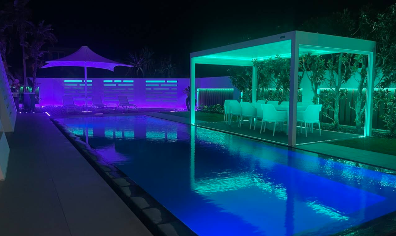 Nighttime Pool Scene With Teal and Purple Led Lighting — CDT Electrical in Tweed Heads, NSW