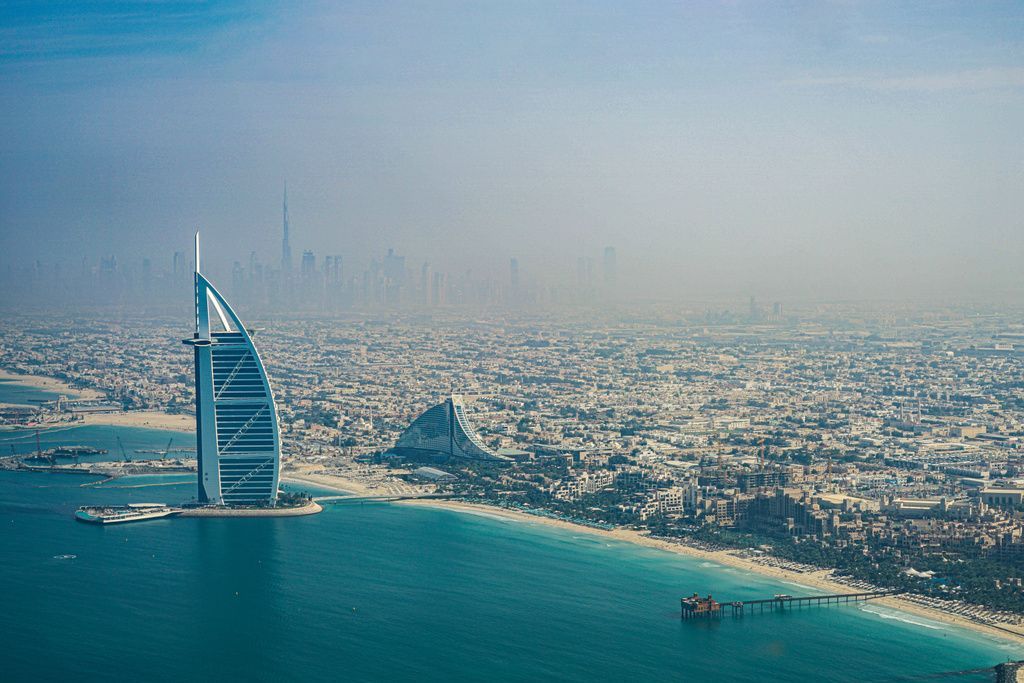 Dubai skyline with iconic landmarks such as the Burj Khalifa and modern skyscrapers.