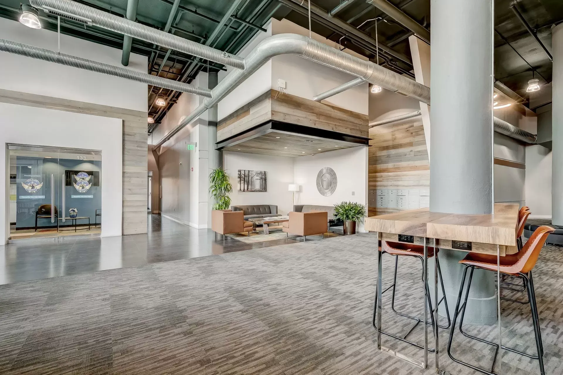 a large room with a table and chairs in it .