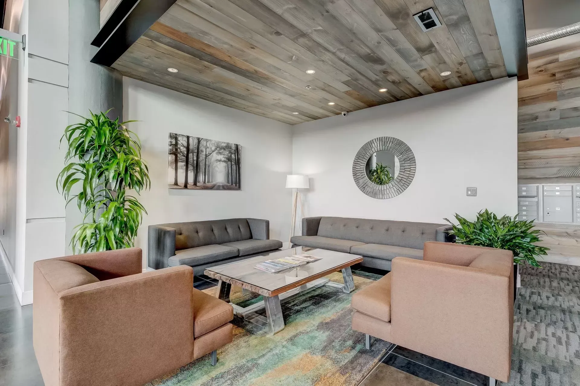 a living room filled with furniture and a wooden ceiling .