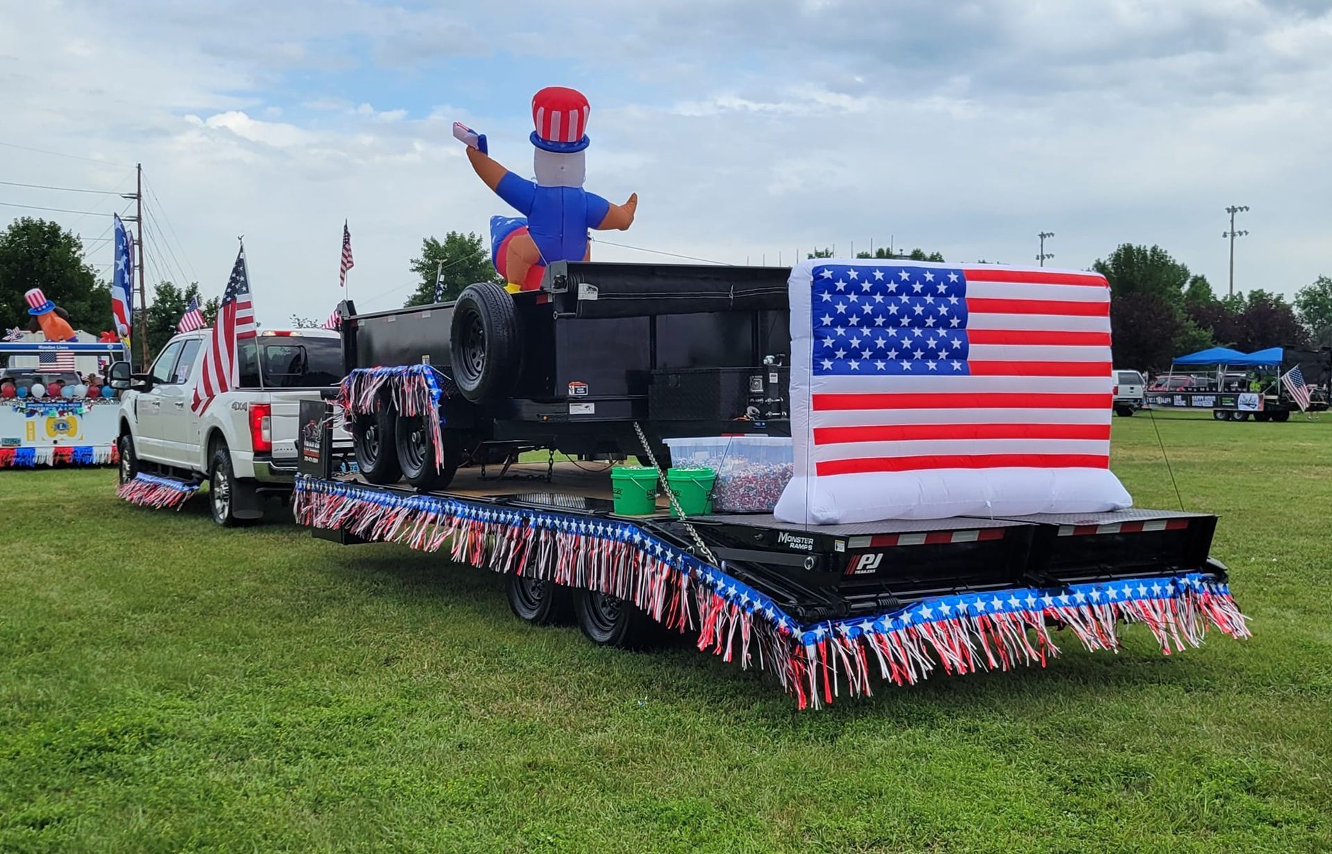 A float is being pulled by a truck in a parade.
