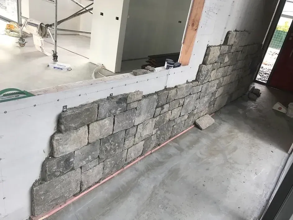 a photo of mid installation of stone clips