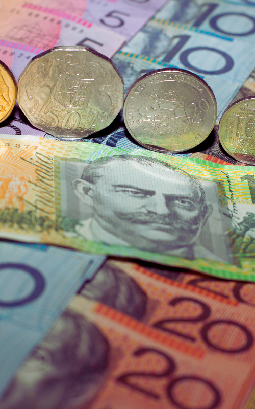 Australian currency: banknotes and coins, including $5, $10, and $20 notes, and 50 cent coins.