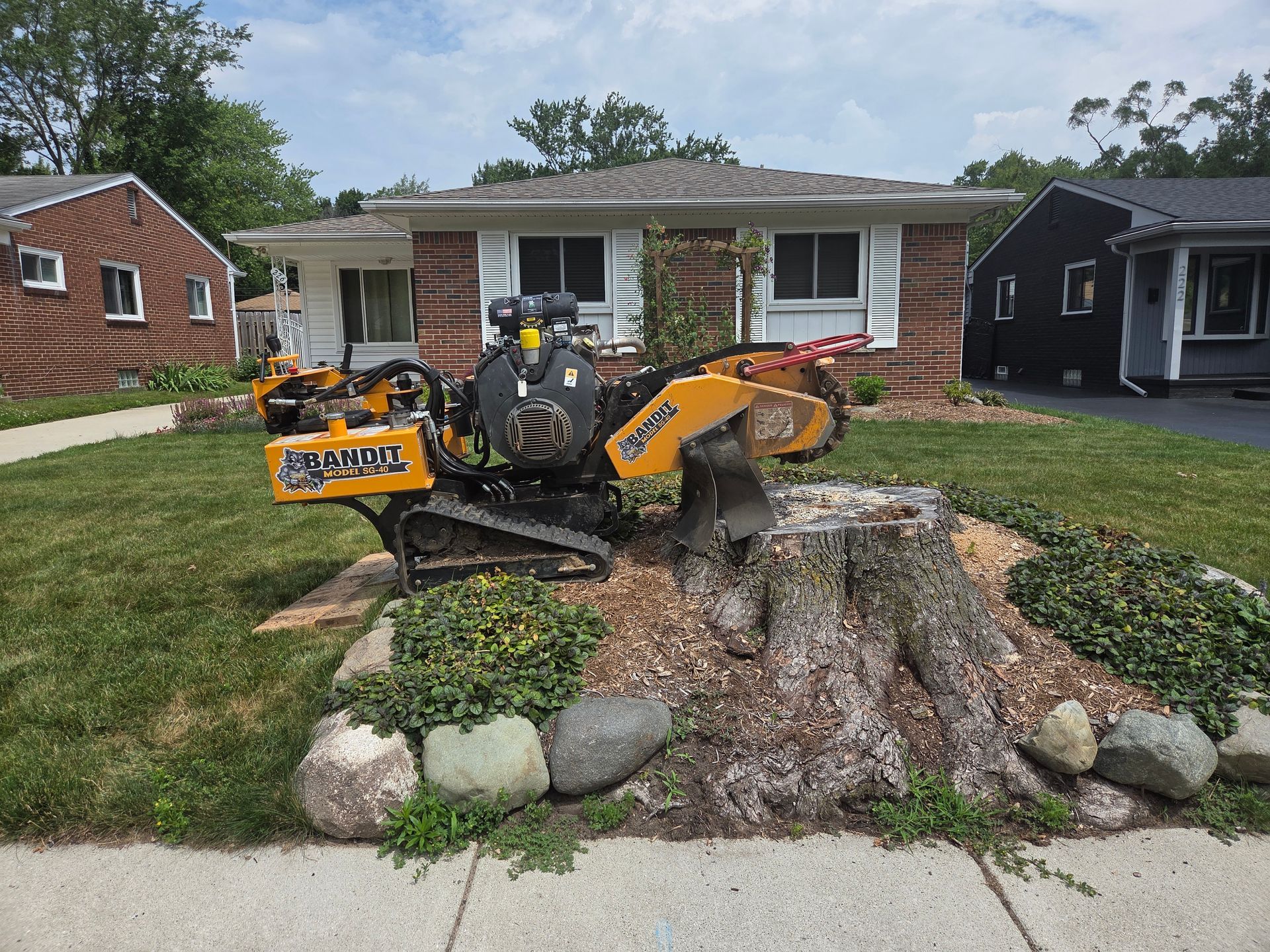 Stump Grinding to hollow out the center of tree stump, as requested by the homeowner to create a flower bed.