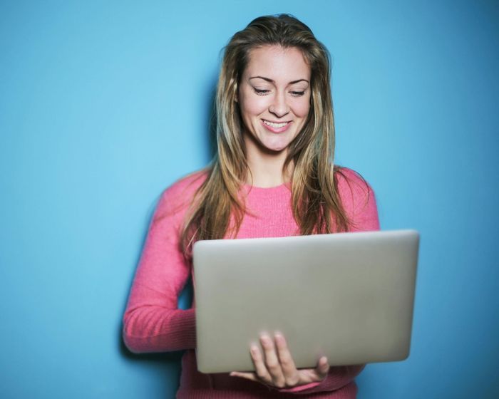 woman holding laptop