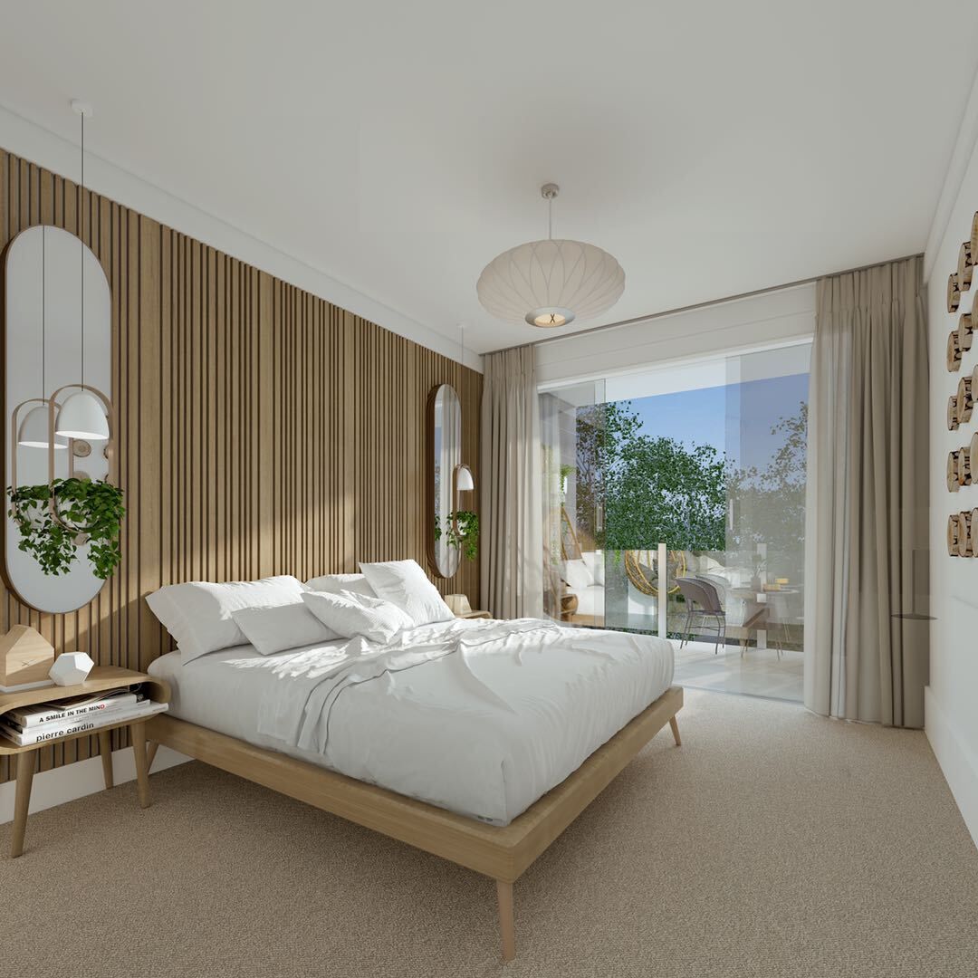 A bedroom with a large bed and a sliding glass door