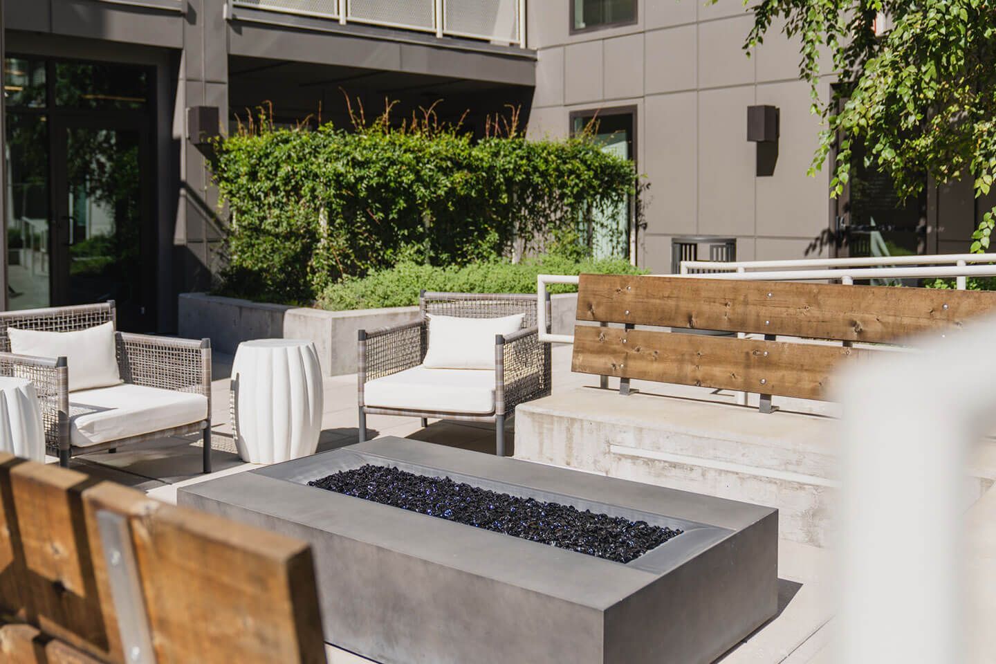 There is a fire pit in the middle of the patio.