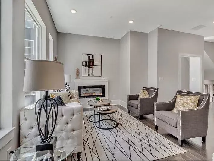 A living room filled with furniture and a fireplace.