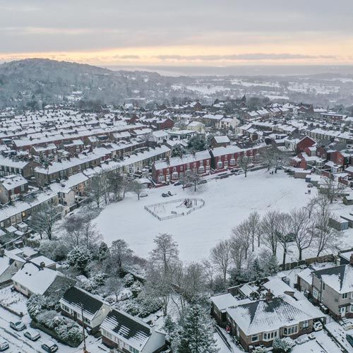 An aerial shot of a town in winter