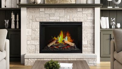 A living room with a fireplace and a coffee table.