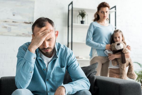 daughter afraid of father and mother holding her