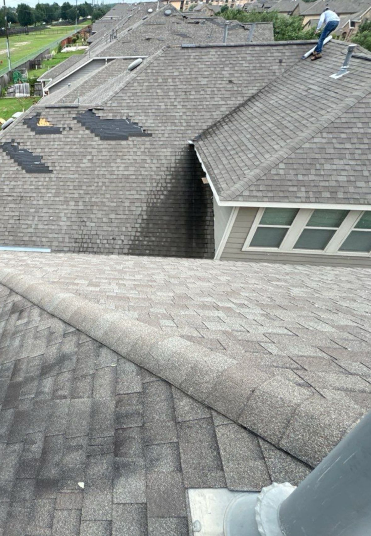 Shingles being repaired during a roof replacement in Houston.