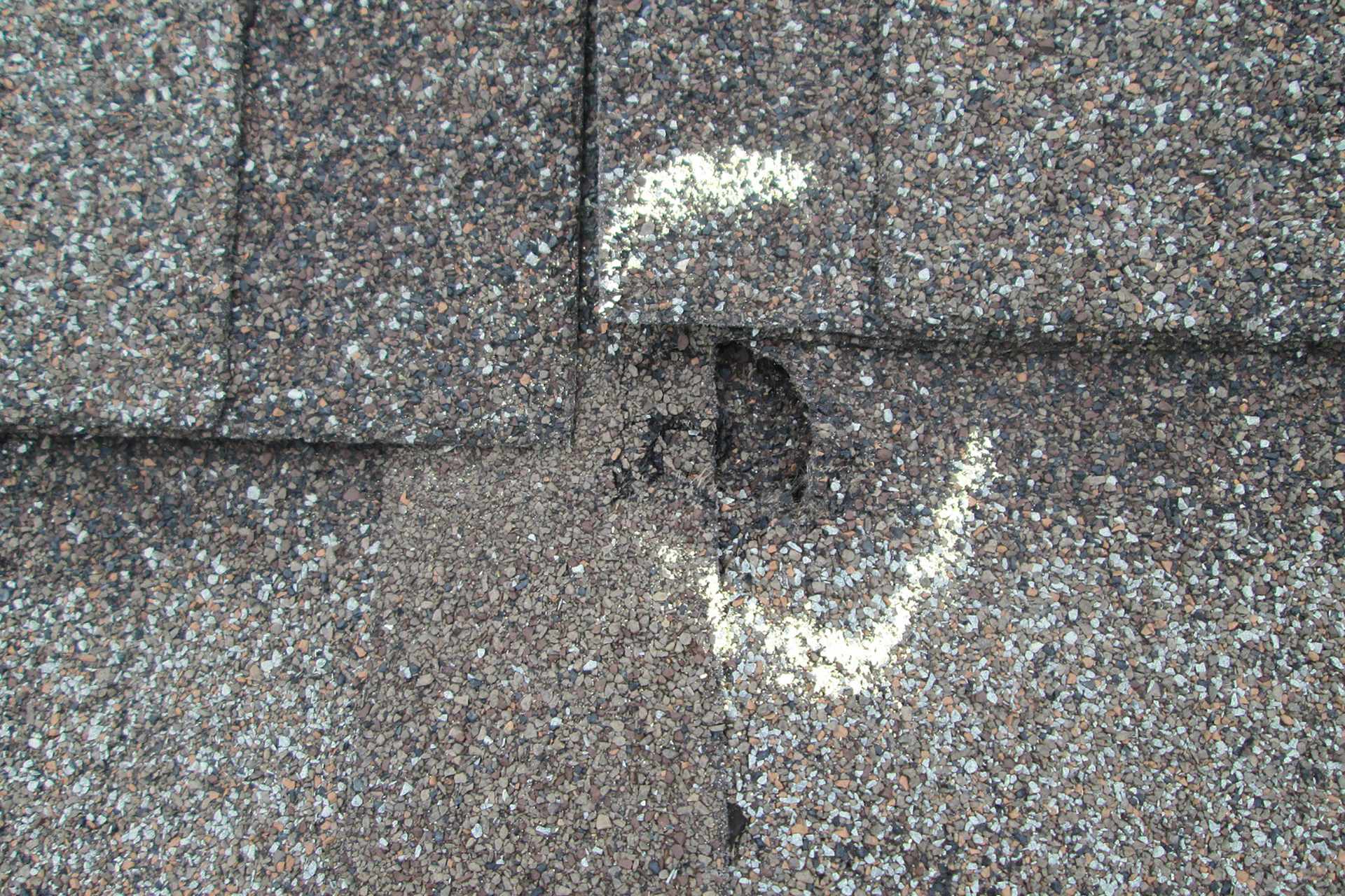 Minor roof damage in Houston from a hail storm.