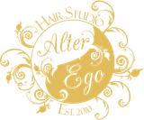 Logo for Alter Ego Hair Studio, a salon. Gold circle, witext, decorative flourishes.